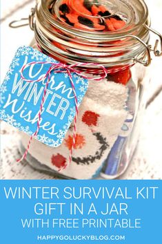 a mason jar filled with winter survival kits and text overlay reads, winter survival kit gift in a jar with free printable