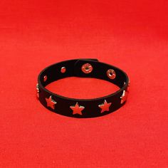 Star wristband bracelets available in: - Single row - 3 row  - adjustable snap button closure  Sold separately   Please review images, the item you see is the item you will receive. Comes from a smoke and pet free environment Edgy Adjustable Star-shaped Jewelry, Adjustable Edgy Star Jewelry, Adjustable Edgy Star-shaped Jewelry, Adjustable Star-shaped Edgy Jewelry, Adjustable Star Shaped Metal Bracelets, Adjustable Leather Bracelet With Rivets For Concerts, Adjustable Star-shaped Metal Bracelets, Adjustable Metal Star Bracelet, Adjustable Star-shaped Bracelet For Festivals