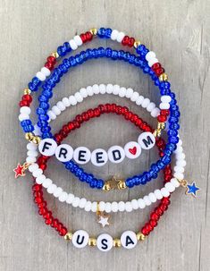 three beaded bracelets with the words freedom and usa written in white, red, and blue beads