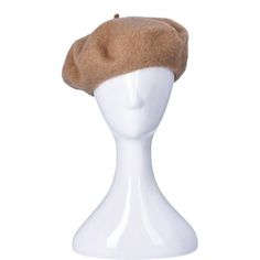 a white mannequin head with a brown hat on it