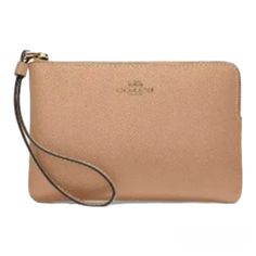 This Beautiful Coach Wristlet Is Perfect For Any Occasion. Crafted From High-Quality Leather, This Wristlet Features A Stylish Gold/Taupe Color With A Solid Pattern And Metal Accents. The Convenient Corner Zip Design Provides Easy Access To Your Credit Cards And Other Essentials While On The Go. With Its Compact Size And Versatile Style, This Wristlet Is A Must-Have Accessory For Any Fashion-Forward Woman. Whether You're Running Errands Or Hitting The Town With Friends, This Coach Wristlet Adds Classic Bags With Wrist Strap For Daily Use, Coach Pouch Wristlet For Travel, Coach Wristlet Pouch For Daily Use, Classic Pouch Wristlet For Daily Use, Beige Rectangular Clutch With Wrist Strap, Classic Wristlet Pouch For Daily Use, Daily Use Coach Wristlet Pouch, Daily Use Coach Pouch Wristlet, Elegant Beige Bag With Wrist Strap