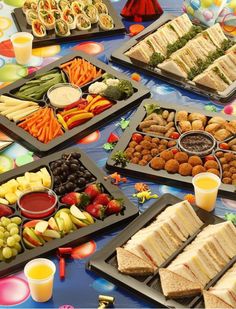 a table filled with lots of food and drinks on it's sides, along with an assortment of appetizers