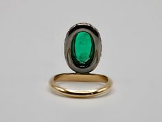 Introducing our dazzling Oval Emerald Donut Ring! This beauty features a vibrant 2.75 carat lab grown oval emerald, hugged by a halo of pave lab grown diamonds in a blackened setting, creating a delightful donut effect. Set atop an 18K yellow gold band, it's a playful twist on classic elegance. Flaunt your unique style with this eye-catching ring that's sure to turn heads! Arielle Ratner Emerald Pave Perch RingLab Grown Gems: Our lab grown stones are not synthetic, or treated. These are 100% sap Arielle Ratner, Donut Ring, Columbian Emeralds, Brooch Jewelry, Lab Diamonds, Classic Elegance, Ring Bracelet, Gold Bands, Lab Grown