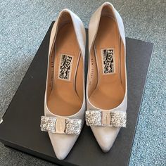 This Pair Is Maker Of Silk Materials And Almost In A Perfect Condition. I Only Wore It A Couple Of Times For Events. My Shoe Size Is Between 6&1/2 To 7. This Pair Will Fit For Us Shoe Size Between 7&1/2 To 8. I Did My Best To Show The Length (See Pic). Luxury Metallic Silver Pointed Toe Heels, Metallic Silver Heels With 4-inch Heel For Formal Occasions, Classic Silver Heels With 4-inch Heel, Classic Silver Low Heel Shoes, Classic Silver Low Heel Heels, Classic Silver Low Heels, Classic Silver High Heels, Metallic Silver Pointed Toe Heels For Wedding, Classic Silver Fitted Heels