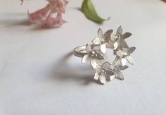 Flower ring, retro ring, floral ring, gold ring women, vintage style ring, handmade boho ring, bunch of flowers ring, vintage ring A romantic, vintage inspired silver ring retro and chic, made with 6 small silver flowers creating a crown on top of a delicate silver band. This bunch of flowers ring is available both in 14 karat gold plating or sterling silver The floral ring is handmade and delicate, and can be a beautiful gift for women. The ring is available in multiple sizes.  Other sizes are Handmade Flower-shaped Ring, Flower Shaped Wedding Rings For Spring, Spring Wedding Rings With Flower Shape, Spring Wedding Rings In Flower Shape, Spring Wedding Flower Ring, Delicate Flower Shaped Ring For Spring, Delicate Flower Ring For Spring, Flower-shaped Wedding Rings For Spring, Handmade Flower Ring For Spring Wedding