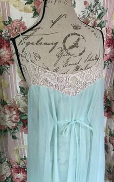 Gorgeous Sea-foam Green nightgown in size Small.  This is an amazing vintage nightgown by Claire Sandra by Lucie Ann. This lovely nightgown is semi sheer chiffon over semi sheer nylon.  Beautiful lace bodice that ties in front creating an elegant look. Also this has a pretty lace lining on the bottom of the skirt.  This is in perfect vintage condition.  There are no holes, stains, or rips.  Please feel free to ask me any questions you may have in regards to size as I do not accept returns due to Flowy Nightgown For Wedding Night, Spring Sheer Nightgown For Sleep, Sheer Summer Nightgown For Bedtime, Summer Sheer Night Sleepwear, Sheer Summer Nightgown For Nighttime, Vintage Sheer Sleepwear For Night, Sheer Spring Nightgown For Bedtime, Sheer Nightgown For Spring Bedtime, Sheer Summer Sleepwear