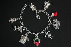 A collection of silver plated Christmas theme charms have been dispersed around a shimmering silver plated bracelet chain in this handmade charm bracelet. This holiday charm bracelet is then completed with a lobster clasp and a 1/2 inch of chain at the end for adjustable sizing. Charms in this bracelet include an enameled red stocking charm with rhinestones charm, enameled green and red wreath charm, reindeer charm, Christmas tree charm, Santa's sleigh charm, Santa stuck in the chimney charm, Sa Xmas Jewelry, Handmade Charm Bracelets, Holiday Bracelets, Christmas Tree Charm, Red Wreath, Santa's Sleigh, Red Stockings, Bracelet Christmas, Silver Plated Bracelet