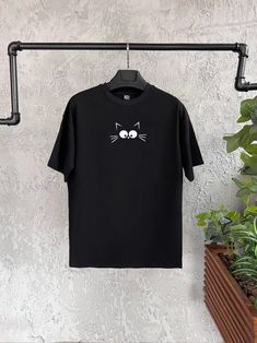 "Cat Face Printed T-Shirt | Funny Cat Print T-Shirt | Unisex Oversize Shirt | Graphic Tee | Animal Printed T-Shirt | Graphic Shirt | Christmas Party Tee | Men Party Wear | Cute Minimalist Shirt  Introducing our \"Cat Face\" Printed Unisex Oversize Black T-Shirt! Buy it with confidence if you are a cat lover or kitten lover. Premium quality, unique design 🐱👚 Add a purrfectly adorable touch to your wardrobe with our \"Cat Face\" Printed Unisex Oversize Black T-Shirt! Reflect your love towards kittens with your style 🌟😺 Round Neck, Comfort Fit, Short Sleeve and eyecatching unique design makes this t-shirt adorable. You can use it daily or wear it on special parties. Perfect t-shirt as a unique christmas, anniversary, birthday gift 🎁  Key Features: 😻 Charming Design: Our \"Cat Face\" pri Relaxed Fit Crew Neck T-shirt With Cat Print, Cat Design Short Sleeve T-shirt For Streetwear, Black Cat Print T-shirt For Streetwear, Casual Short Sleeve T-shirt With Cat Print, Oversized Crew Neck Tops With Cat Print, Oversized Cat Print Crew Neck Top, Relaxed Fit Cat Print T-shirt With Crew Neck, Graphic Tee With Cat Print And Short Sleeves, Short Sleeve Graphic Tee With Cat Print