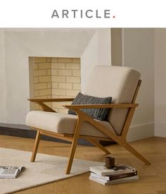 a chair sitting on top of a wooden floor next to a fire place