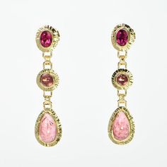 Baksa Notes Pink Tourmaline in three shades of pink, all hinged, sparkle with very movement. Set in bezels with hammered texture frames. Note attachment points are finely detailed. Design Details GOLD - 14k yellow BACKS - Jumbo w/double notched post GEMSTONE - Pink Tourmaline CUT - Oval faceted, Round and Pear cabochon CARAT -Oval 1.67 ct. tw., Round 1.39 ct. tw., Pear 5.61 ct. tw. SIZE - 5x7 mm oval, 5 mm round, 7x12 mm pear OA DIMENSIONS - length 48 mm Yellow Backs, Cabochon Earrings, Detailed Design, Shades Of Pink, Pink Tourmaline, Art Studios, Jewelry Art, Tourmaline, Design Details