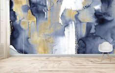 an abstract wallpaper with gold and blue paint on it, in a living room