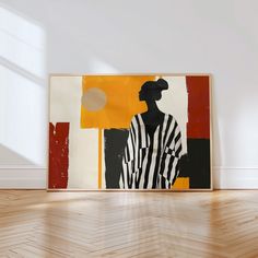 an abstract painting on the wall in a room with hard wood flooring and white walls