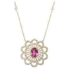 An exquisite necklace made of 18-karat yellow gold, set with a 0.81-carat diamond and a 1.61-carat natural pink sapphire. The necklace chain has a diamond by yard chain setting, and you are able to change the necklace's length as well. The necklace is 18 inches long, but you may modify the size to make it 16, 17, or 18 inches long. Pink Diamond Cut Fine Jewelry Necklace, Luxury Elegant Pink Sapphire Necklaces, Pink Diamond Necklace With Hand-set Details, Luxury Pink Sapphire Yellow Gold Necklace, Luxury Pink Sapphire Pendant Jewelry, Stunning Necklace, Pink Sapphire, Necklace Designs, Chains Necklace