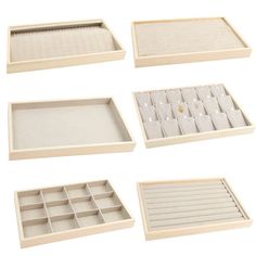 six empty trays with dividers on each side and one open drawer in the middle