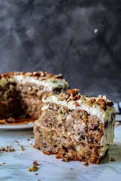 there is a piece of cake that has been cut in half and sits on the table