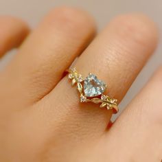 Cue the romance with our stunning Heart’s Desire Aquamarine Ring. This perfect expression of true love features a heart-shaped aquamarine center stone along with a curved white topaz leafy band that adds a natural charm. A cherished keepsake that radiates love from every angle. ✦ Available in both 14K yellow gold vermeil (14K yellow gold plated over a sterling silver base) and 10K solid yellow gold. Aquamarine Heart Ring, Engament Rings, Heart Solitaire Ring, Expression Of Love, Heart Wedding Rings, Heart Promise Rings, Promise Ring For Her, Cute Engagement Rings, Gold Promise Rings