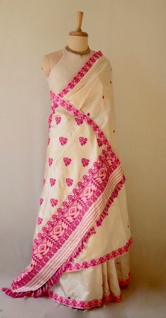 Handloom Silk Saree  from the looms of Assam, India. The saree has Tassar silk in the warp and Mulberry Silk in the  weft . Mulberry Silk is also known as Paat Silk in Assam. The motifs have been woven in acrylic and cotton. The light golden colour is due to the presence of tassar silk which naturally comes in light golden brown to off white . The design and colour schemes are very traditional and the saree can be worn in all kinds of occasions and functions.  It has a soft hand feel due to mulb Luxury Cotton Silk Saree With Gota Work, Luxury Semi-stitched Cotton Silk Saree, Pohela Boishakh Saree, Festival Pre-draped Chanderi Saree With Woven Motifs, Festive Pre-draped Saree With Weaving Work, Traditional Drape Blouse With Woven Motifs, Festive Woven Motifs Blouse, White Dupatta With Woven Motifs For Transitional Season, Transitional Bollywood Blouse Piece With Woven Motifs