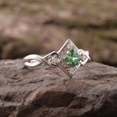 "Vintage style 925 sterling silver art deco emerald promise ring for her, Unique geometric celtic style womens emerald engagement ring WE OFFER UNLIMITED PERIOD INSTALLMENTS PLAN This is a beautiful, stunning, feminine ring that works well for all occasions, styles, and ages. You will love it! Ring information Main stone: Emerald Approximate size: 4x4mm Accent stones: White cubic zirconia Approximate size: 1.5mm (4 stones) Metal type: Silver Metal stamp: 925 Sterling SIlver Customization / Repla Dainty Emerald Jewelry For Promise, Silver 14k White Gold Promise Ring, 14k White Gold Silver Promise Ring, Sterling Silver Jewelry For Promise Ring In Diamond White, Emerald Cut Birthstone Jewelry For Promise, Promise Jewelry With May Birthstone, Sterling Silver Emerald Promise Ring, Sterling Silver Emerald Promise Ring For May Birthstone, Elegant Sterling Silver Jewelry With Princess Cut