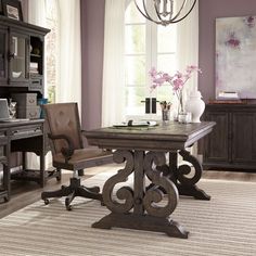 a dining room table with chairs and a chandelier