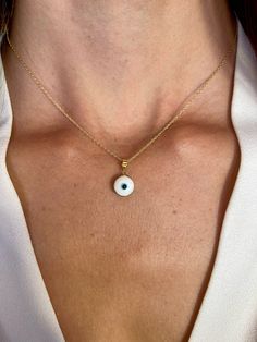 This 14k gold evil eye pendant offers a minimalist yet powerful symbol of protection and good luck. Its tiny design adds a subtle touch of spirituality to any outfit. As a graduation gift for her, it symbolizes not only well wishes for success but also protection and guidance as she embarks on new journeys. This spiritual symbol jewelry serves as a meaningful and thoughtful token of support and encouragement during this important milestone in her life. * DETAILS * * Material: 14K Solid Yellow/Wh Minimalist Gold Evil Eye Jewelry, 14k Gold Charm Necklace With Evil Eye, 14k Gold Round Evil Eye Charm Necklace, Dainty 14k Gold Evil Eye Jewelry, Minimalist Round Evil Eye Jewelry, Everyday Yellow Gold Evil Eye Jewelry, 14k Gold Evil Eye Charm Necklace With Round Pendant, 14k Gold Evil Eye Necklace With Round Pendant, 14k Gold Evil Eye Charm Necklace As Gift