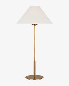 a brass table lamp with a white shade