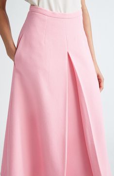 An inverted pleat at the front flaunts the crispness of Wickstead's tailoring skills on this midi skirt made from rosy, richly textured crepe. 32" length (size 18UK) Hidden back-zip closure Side-seam pockets Lined 95% polyester, 5% elastane Dry clean Made in the UK Designer Clothing Formal A-line Maxi Skirt With Pleated Waist, Formal A-line Bottoms With Box Pleat, Elegant A-line Maxi Skirt With Pleated Hem, Feminine A-line Pleated Skirt, Cocktail A-line Skirt With Pleated Waist, Feminine Pink A-line Skirt, Formal Fitted Skirt With Box Pleats, Elegant Asymmetrical Pleated Relaxed Skirt, Feminine Pleated Skirt For Evening