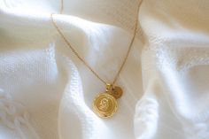 This locket necklace features a charming flower design and a flat circular shape. It serves as a keepsake for your most treasured memories, allowing you to insert a photo within it. Talk about a perfect gift idea! * How To Order 1. Choose the size. 2. Select initials, if you do not want any initial, select "NONE" (UPPER CASE and HEART Shape Available) if you want LOWERCASE please message me BEFORE placing the order!) 3. Add to cart and submit order :) * Locket : Photo Frame Pendant, Flat Round w Circle Locket, Frame Necklace, Flower Circle, Studded Necklace, Pendent Necklace, Personalized Gifts For Her, Pearl Gemstone, Upper Case, Gift For Birthday