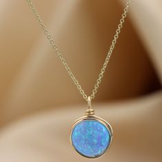 A beautiful large Opal necklace is the perfect statement piece. Set with a genuine 10 mm blue Opal gemstone Most recommended as a set with our beautiful Blue Opal ring :) Link: https://www.etsy.com/il-en/listing/879805308/blue-opal-knot-ring-handmade-ring-opal?ref=shop_home_active_5&pro=1&frs=1 ☆ WHY THIS PIECE OF J E W E L R Y IS AWESOME! ☆ * Hand finished and made from high quality raw materials * Available in Gold filled, Red gold Filled or Sterling Silver * Long lasting beauty & Elegant Blue Necklace For Birthday Gift, Opal Birthstone Necklaces, Round Opal Birthstone Necklaces, Opal Birthstone Round Necklaces, Elegant Blue Jewelry For Birthday Gift, Elegant Opal Necklace With Wire Wrapped Detail, Gold Opal Round Necklaces, Gold Opal Round Necklace, Gold Opal Jewelry With Round Stone