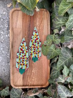 Poppy flower beaded earrings, powder green floral Fringe Seed bead earring Summer Bright flowers earring Beadwork dangle earring Long Boho ♥𝑇ℎ𝑒 𝑝𝑎𝑡𝑡𝑒𝑟𝑛 𝑜𝑓 𝑡ℎ𝑖𝑠 𝑒𝑎𝑟𝑟𝑖𝑛𝑔 𝑖𝑠 𝑐𝑟𝑒𝑎𝑡𝑒𝑑 𝑏𝑦 𝐾𝑎𝑍𝑒𝐵𝑒𝑎𝑑𝐽𝑒𝑤𝑒𝑙𝑟𝑦 ♥𝑀𝑎𝑑𝑒 𝑢𝑠𝑖𝑛𝑔 𝑓𝑟𝑒𝑒ℎ𝑎𝑛𝑑 𝑏𝑒𝑎𝑑𝑖𝑛𝑔 𝑤𝑜𝑣𝑒𝑛 𝑡𝑒𝑐ℎ𝑛𝑖𝑞𝑢𝑒𝑠 𝑤𝑖𝑡ℎ 𝑠𝑡𝑟𝑜𝑛𝑔 𝑠𝑦𝑛𝑡ℎ𝑒𝑡𝑖𝑐 𝑡ℎ𝑟𝑒𝑎𝑑. ♥𝑇ℎ𝑒 𝑠𝑖𝑧𝑒 𝑜𝑓 𝑡ℎ𝑒 𝑠𝑒𝑒𝑑 𝑏𝑒𝑎𝑑𝑠 𝑢𝑠𝑒𝑑 𝑖𝑠 2 𝑚𝑖𝑙𝑙𝑖𝑚𝑒𝑡𝑒𝑟𝑠 𝑎𝑛𝑑 𝑏𝑒𝑎𝑑𝑠 𝑎𝑟𝑒 ℎ𝑖𝑔ℎ 𝑞𝑢𝑎𝑙𝑖𝑓𝑖𝑒𝑑. ♥𝐴𝑙𝑙 𝑡ℎ𝑒 ℎ𝑜𝑜𝑘𝑠 𝑢𝑠𝑒𝑑 𝑖𝑛 𝑜𝑢𝑟 𝑗𝑒𝑤𝑒𝑙𝑟𝑦 𝑎𝑟𝑒 24 𝑘 𝑔𝑜𝑙𝑑 𝑝𝑙𝑎𝑡𝑒𝑑 𝑎𝑛𝑑 ℎ𝑦𝑝𝑜𝑎𝑙𝑙𝑒𝑟𝑔𝑒𝑛𝑖𝑐. ♥𝑇ℎ𝑒𝑠𝑒 𝑎𝑟𝑒 𝑣𝑒𝑟𝑦 𝑙𝑖𝑔ℎ𝑡 𝑒𝑎𝑟𝑟𝑖𝑛𝑔𝑠 𝑡ℎ𝑎𝑡 𝑦𝑜𝑢 𝑐𝑎𝑛 𝑤𝑒𝑎𝑟 𝑎𝑙𝑙 𝑑𝑎𝑦 𝑤𝑖𝑡ℎ𝑜𝑢𝑡 ℎ𝑢𝑟𝑡𝑖𝑛𝑔 𝑦𝑜𝑢𝑟 𝑒𝑎𝑟! The onl Multicolor Flower Beaded Earrings With Tiny Beads, Multicolor Flower-shaped Beaded Earrings With Tiny Beads, Multicolor Flower Shaped Beaded Earrings, Multicolor Flower-shaped Beaded Earrings, Bohemian Tiny Beads Flower Earrings, Bohemian Flower Beaded Earrings With Tiny Beads, Bohemian Flower Shaped Beaded Earrings With Tiny Beads, Bohemian Flower Shaped Beaded Earrings, Handmade Green Flower Drop Earrings