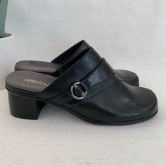 Be Cute, Comfortable And Casual All Day In The Peplum From Aerosoles. This Cushioned Mule Style Will Finish Any Outfit From Denim To Dresses! Brand New Black Synthetic Mules For Office, Black Leather Mules With Arch Support, Black Mules With Arch Support, Black Mules With Cushioned Footbed, Medium Width, Black Mules With Buckle Closure For Work, Medium Width Synthetic Heels With Leather Footbed, Black Slip-on Mules With Arch Support, Black Synthetic Slip-on Heels, Black Medium Width Mules For Work