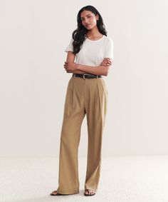 Riley Trouser Safari The perfect summer-ready trouser that features a lightweight feel. Meant to be worn with a relaxed fit for a breezy and effortless look. 50% linen, 47% viscose, 3% spandex. Made in Turkey. Features box pleat in the front. | Jenni Kayne Women's Riley Trouser Size 14 Effortless Relaxed Fit Straight Leg Pants, Versatile Straight Leg Viscose Bottoms, Summer Viscose Wide-leg Pants, Summer Wide-leg Viscose Pants, Viscose Wide Leg Pants For Daywear, Wide Leg Viscose Pants For Daywear, Relaxed Straight Leg Work Pants, Wide Leg Pants For Business Casual In Summer, Summer Wide Leg Pants For Business Casual