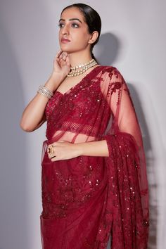 Maroon saree with floristry, sequin embroidery. Paired with blouse and petticoat.
Component: 3
Pattern: Embroidery
Type Of Work: Floristry, sequin
Neckline: Leaf neck
Sleeve Type: Sleeveless
Fabric: Tulle
Color: Maroon
Other Details: 
Jaal pattern on blouse
Sheer panelled pallu
Occasion: Reception - Aza Fashions Maroon Saree, Tulle Embroidery, Embroidered Saree, Sequin Embroidery, Pattern Embroidery, Blouse For Women, Sequins Embroidery, Fashion App, Saree With Blouse