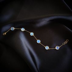 "ITEM DESCRIPTION: >> The bracelet is made from Solid 14K Yellow Gold. Gemstone used is absolutely natural and ethically sourced.  >> Natural Rainbow Moonstones cabochon in Round shape with bezel setting is studded on it with utmost precision.  >> This is a minimalist design and is absolutely hassle-free and everyday jewelry.  ✓ Gem: Rainbow Moonstone ✓ Gem size: 8x8mm,round (6 pcs) ✓ Gem weight: 8.01 carats ✓ Bracelet Length: 7\" Inches + 0.5\" Inch Adjustable ✓ Gold purity: 14K  The Gold purit Gold Moonstone Round Bracelets, Round Natural Stones Bracelet In Fine Jewelry Style, Round Natural Stones Bracelets Fine Jewelry, Fine Jewelry Bracelets With Natural Stones, Elegant Moonstone Crystal Bracelet For Gift, Luxury Round Moonstone Jewelry, Gold Moonstone Gemstone Bracelets, Gold Moonstone Bracelet With Gemstones, Round Moonstone Bracelets With Natural Stones