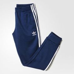 SUPER SPORTSWEAR BRAND NEW!   AUTHENTIC ADIDAS APPAREL ADIDAS ORIGINALS MEN'S SPORTSWEAR COLLECTION     SUPERSTAR CUFFED TRACK PANT   Men's Size: 2XL   Color: Collegiate Navy/White     Classic track pants get a style update with a slim fit and elastic leg cuffs for a modern look. Timeless track pants get a modern look. Updated with a slim fit and elastic leg cuffs, these men's pants show adidas pride with an embroidered Trefoil logo on one hip and 3-Stripes down the legs. They have side pockets Adidas Moisture-wicking Sweatpants For Jogging, Adidas Logo Sweatpants For Training, Adidas Cotton Activewear, Adidas Cotton Sporty Activewear, Sporty Navy Cotton Sneakers, Adidas Casual Streetwear Activewear, Adidas Activewear For Streetwear, Casual Adidas Sports Bottoms, Blue Sporty Sweatpants With Three Stripes Branding