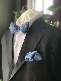 "* Simply Me * Gentlemen * Est. 2017 LLC * \"SIMPLY ME * GENTLEMEN::  BOW TIE AND COORDINATING POCKET SQUARE\" Dressed up or dressed down is how you can wear my handmade bow ties for all the men in your life. Be Dapper, Be Classy, Be a Gentleman is what my bow ties represent.  So Wear them Confidently, and Wear them with Pride.    Bow ties will never go out of style, but my goal is to have them integrated into menswear for everyday wear.  \"DESCRIPTION AND DETAILS\" You can look professional, st Blue Spring Wedding Suit, Blue Suit And Tie Accessories For Wedding, Dapper Blue Bow Tie For Groom, Classic Blue Bow Tie For Wedding, Elegant Blue Suit With Pocket Square, Elegant Blue Pocket Square For Semi-formal Occasions, Blue Classic Wedding Suit And Tie Accessories, Elegant Blue Semi-formal Pocket Square, Classic Blue Bow Tie For Groom