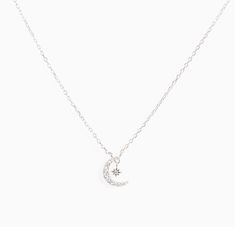 Star + Moon necklace with bling! *Length: Adjustable from 16 to 18 inches *Material: Sterling silver or sterling silver covered in 16K gold with cubic zirconia