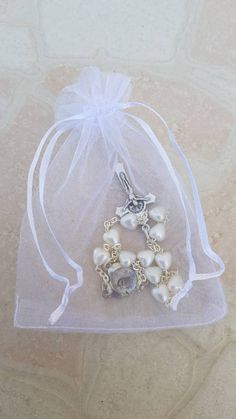 Wedding rosary with hearts beads. Saint wedding souvenirs for guests. Design with 8mm champagne color hearts beads compact in one decade, plus silver oxidized Virgin Mary medal centerpiece and St.Benedict cross. It is an ideal gift for a wedding, first communion, confirmation, anniversary .... It can be personalized. With each rosary you get a beautiful white bag as a gift. Like a wedding gift: You can put the initials of the bride at the beginning (first pearl) and groom at the end (tenth pearl Weding Gift, Wedding Souvenirs For Guests, Wedding Rosary, Our Lady Of Medjugorje, St Benedict Bracelet, St Benedict Cross, Olive Wood Cross, Rosary Gift, St Benedict