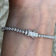 Men's & women's one row tennis bracelet. Solid 925 sterling silver w/ rhodium finish. Dazzling one row tennis bracelet design. Choose 6", 6.5", 7",7.5" 8", 8.5" x 2MM thick. Solid jewelry piece weighs 6.5-9 grams ea. 4 prong setting 3ct (cz) that shine bright. Stylish box lock w/double safety latches. 925 won't turn or make your wrist green. Lab tested 925 silver is guaranteed genuine. Luxurious piece looks like a million bucks. 30 day returns for your complete satisfaction. 100% FREE SHIPPI Bracelet Design, Hip Hop Jewelry, Tennis Bracelet, Shine Bright, Bracelet Designs, Solid 925 Sterling Silver, Prong Setting, Diamond Bracelet, Jewelry Pieces