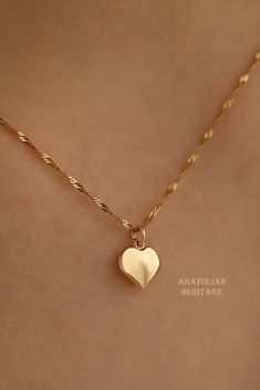 Handmade 14k Gold Heart Shaped Necklace for Women This is a beautifully detailed handmade 14K Solid Gold necklace with a minimalist heart shaped pendant on it. This is a great gold necklace for everyday use, but also good for special occasions. Also great gift for Valentine's day. Chain is also 14k Solid Gold and its length is 45 cm, weight is 1.65 grams.  Length: 45 cm Weight of Chain: 1.65 gr Pendant: 16 mm x 9 mm  Since this is a handmade product there might be slight changes like its weight Elegant 14k Gold Filled Heart Necklace, Classic Double Heart 14k Gold Necklaces, Classic 14k Gold Double Heart Necklaces, Everyday 14k Rose Gold Heart Necklace, Everyday Rose Gold 14k Heart Necklace, 14k Gold Heart Charm Necklace For Wedding, Minimalist 14k Gold Necklace With Heart Charm, Dainty 14k Gold-filled Heart Necklace In Yellow Gold, Dainty 14k Gold-filled Yellow Gold Heart Necklace