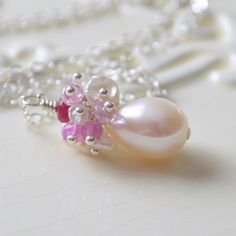 This bridal necklace is a perfect choice for a traditional wedding, where the bride wants just a touch of colour. Its pink and ivory colour combination Delicate Pink Jewelry For Anniversary, Wedding Pearl Necklace With Gemstone, Delicate Pink Necklace For Bridesmaid Gift, Pink Pearl Pendant Jewelry For Wedding, Pearl White Gemstone Necklace For Wedding, Pink Pearl Jewelry For Gifts, Pink Pearl Jewelry For Gift, Elegant Pink Bridal Necklace For Wedding, Pink Pearl Jewelry Gift