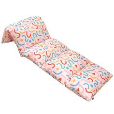 a pink and multicolored pillow that is shaped like the letter s on it