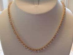 "ALL HANDMADE 14K SOLID YELLOW GOLD NECKLACE WITH 105 GRADUATED ALL NATURAL, MINED WHITE SAPPHIRES - NOT LAB CREATED. GUARANTEED. RECENTLY APPRAISED BY A GIA GRAD GEMOLOGIST. ABSOLUTELY STUNNING, WORN ONLY A HANDFUL OF TIMES. I AM THE SOLE OWNER. IT HAS A SECURE TONGUE CLASP CLOSURE & WRAP-AROUND CATCH THAT SNAPS SHUT TIGHTLY FOR ADDITIONAL SECURITY. Approximately 57 carats total of sapphires. Largest stone approx. 6 mm and smallest approx. 2.5mm. VS clarity. Total gram weight for the neckla Yellow Gold Single Strand Necklace For Wedding, Gold Bridal Necklace For Anniversary Fine Jewelry, Gold Tennis Necklace With Prong Setting As Gift, Gold Tennis Necklace With Diamond Accents For Anniversary, Gold Cubic Zirconia Tennis Necklace For Anniversary, Gold Brilliant Cut Necklace For Wedding, Formal Gold Bridal Necklace With Diamond Cut, Gold Single Strand Bridal Necklace For Formal Occasions, Formal Gold Bridal Necklace Single Strand