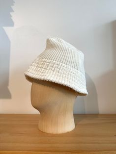 Cableami white cotton knit bucket hat with a linen-like feel. 100% pre-organic cotton. Beanies, caps, hats are all one size fits most. Made in Japan.ABOUTCABLEAMI began in Kobe Japan in 2008 with a name inspired by the Alan Cable knitting pattern. "Ami" in Japanese means "knit” and in French, means "friend". Those two themes create the philosophy around the brand, interweaving good fit, unique design, and traditional-casual elements. White Knitted Bucket Hat For Summer, Knitted Cotton Bucket Hat One Size, Knitted Cotton Bucket Hat, Hand Knitted White Cap, White Hand-knitted Bucket Hat, Cable Knitting Pattern, Knit Bucket Hat, Mean Friends, Kobe Japan