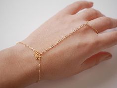 This Original Hand Jewelry is perfect for bridesmaid, wedding,... This Hand Bracelet is made with Gold plated differents chain, and Gold plated Lotus Flower.  ➵ Perfect to wear alone or for layering with more bracelets.➵ The bracelet length is ajustable thanks to 5 cm (2 in) extender chain.--*--*--*--*--*--*--*--*--*--*--*--*--*--*--*--*--*--*--∞ SIZE ∞- Bracelet length: Adjustable bracelet - around 15 cm (5.9 in) - 20 cm (7.9 in).If you like another length please make a note when you "check out Gold Bracelet Jewelry For Wedding, Gold Wedding Bracelet Jewelry, Adjustable Simple Bracelet Jewelry, Adjustable Simple Bangle Jewelry, Dainty Bangle Jewelry For Bridesmaid Gift, Simple Gold Jewelry For Wedding, Dainty Bangle For Bridesmaid Gift, Rose Gold Bracelet For Bridesmaid Gift, Adjustable Bangle Jewelry For Wedding