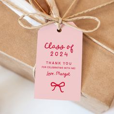 a close up of a tag on a gift box with the words class of 2012 thank you for celebrating with me