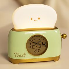 a toast alarm clock sitting on top of a table