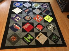 there is a quilt with many different patches on it