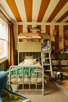 there is a bunk bed in the middle of this room with striped walls and flooring