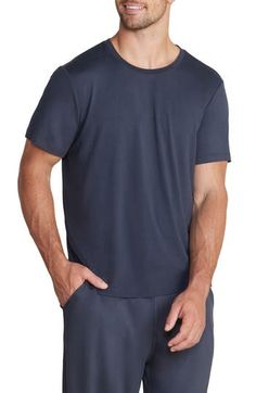 Lightweight and exceptionally soft, this stretchy T-shirt makes a great choice for the gym, a relaxing afternoon or a night of sweet, sweet slumber. Crewneck Short sleeves 91% polyester, 9% spandex Machine wash, tumble dry Imported Moisture-wicking Stretch T-shirt For Loungewear, Blue Stretch T-shirt For Loungewear, Stretch Athleisure Top For Relaxation, Basic Moisture-wicking Tops For Loungewear, Sporty Solid Color Tops For Relaxation, Soft Stretch Tops For Loungewear, Casual Fitted Tops For Lounging, Comfortable Solid Color Tops For Relaxation, Casual Moisture-wicking T-shirt For Loungewear