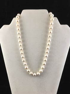 "The luster on the 10-11 white freshwater cultured pearls are amazing! This strand measures 18\" and are knotted between each bead which are attached to a 14k white gold clasp." Classic Pearl Necklace With Polished Beads, Formal Pearl Necklace With Polished Beads, Classic Polished Pearl Necklace For Wedding, Classic Wedding Pearl Necklace With Polished Beads, Formal Polished Pearl Necklace, Pearl White Necklace With Sterling Silver Clasp, White Polished Pearl Necklace For Formal Occasions, Akoya Pearl Necklace With Sterling Silver Clasp, White Akoya Pearl Necklace With Sterling Silver Clasp